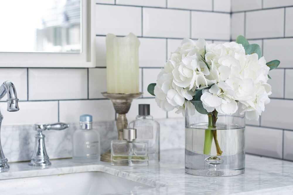 White Hydrangea & Eucalyptus Arrangement in Glass Cylinder Vase