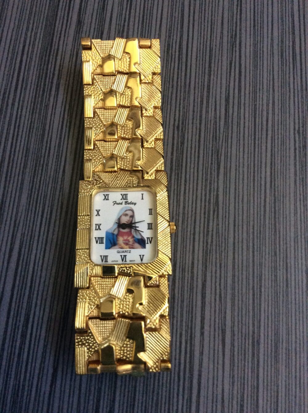 Men's Gold Religious Watch Rectangle White Virgin Mary Dial Roman Numeral Hours On A Nugget Linked Band Vintage Un-Used New/Old Stock