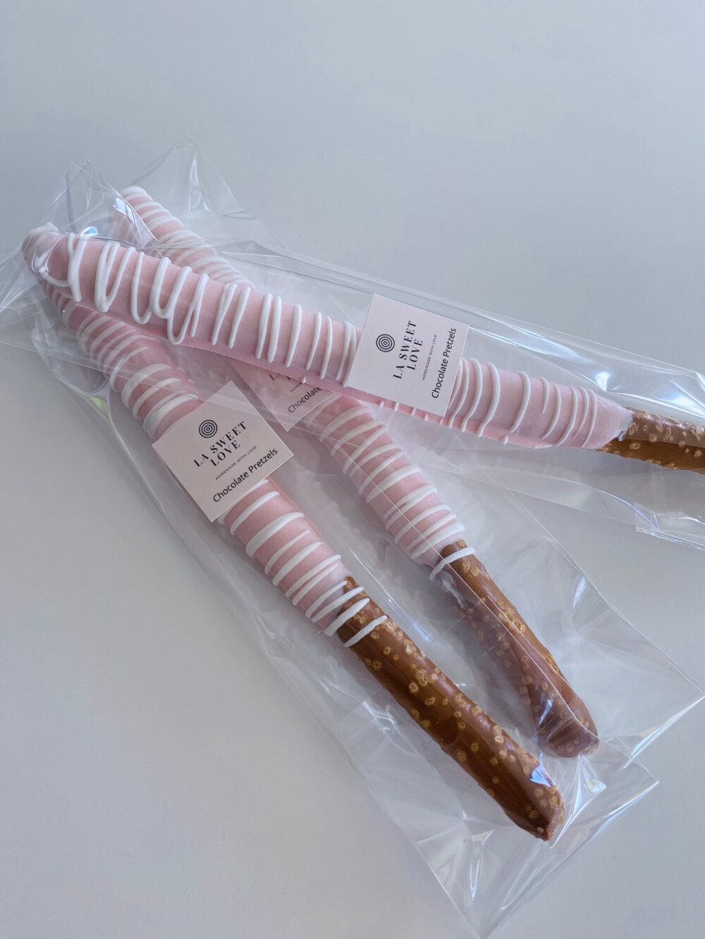 Light Pink Chocolate Pretzel Rods - Dozen | 12